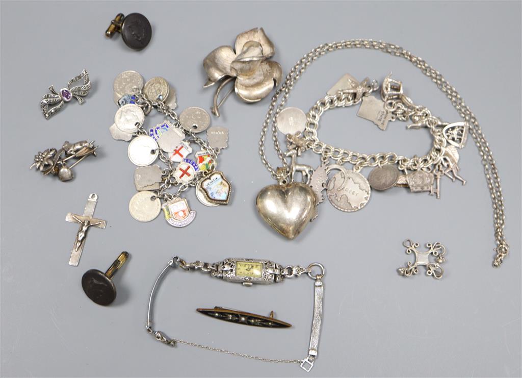 A white metal charm bracelet hung with enamel medallions, one other charm bracelet, marcasite watch and pendant etc.